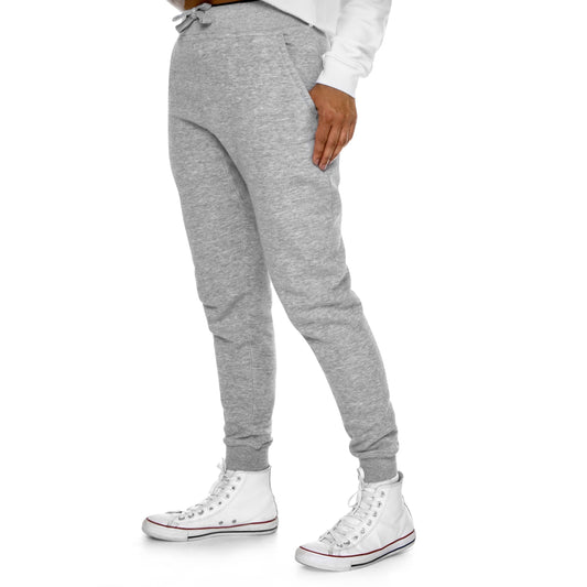 Snug Slate - Premium Fleece Joggers offer both comfort and style. Crafted from 80% combed ringspun cotton and 20% recycled polyester, these joggers prioritize softness, durability, and sustainability. With a cozy 3-end fleece lining, they're perfect for indoor and outdoor relaxation. The slim-tapered fit, ribbed waistband, and pockets make them versatile for lounging or a quick run.