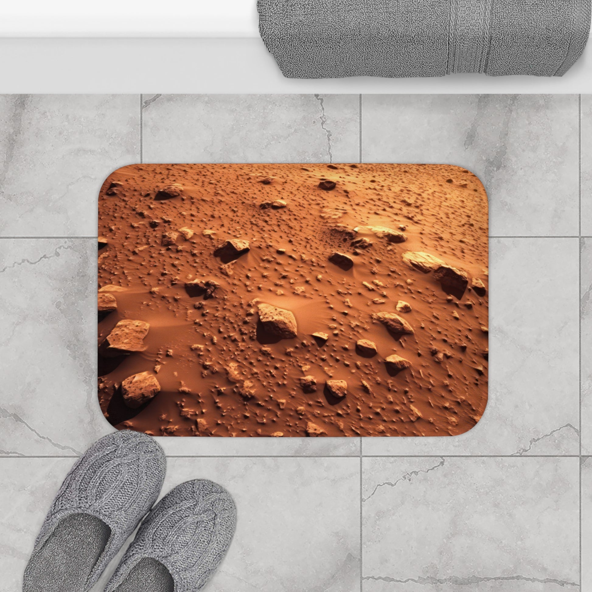 Elevate your bathroom decor to interplanetary levels with Walking On Mars - Bath Mat. Featuring a captivating Mars surface graphic on durable 100% microfiber, it adds an otherworldly touch. The anti-slip backing ensures stability, and the bound edges guarantee longevity.