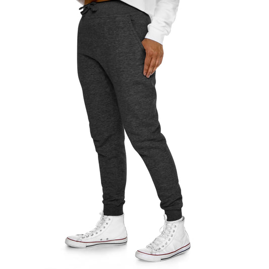 Elevate your comfort with Midnight Charcoal - Premium Fleece Joggers. Crafted from 80% combed ringspun cotton and 20% recycled polyester, they combine softness and durability. The medium-heavy fabric provides cozy warmth without excess weight, perfect for lounging or a spontaneous run. Designed with a slim-tapered fit and featuring side and back pockets, these joggers offer both style and functionality in one.