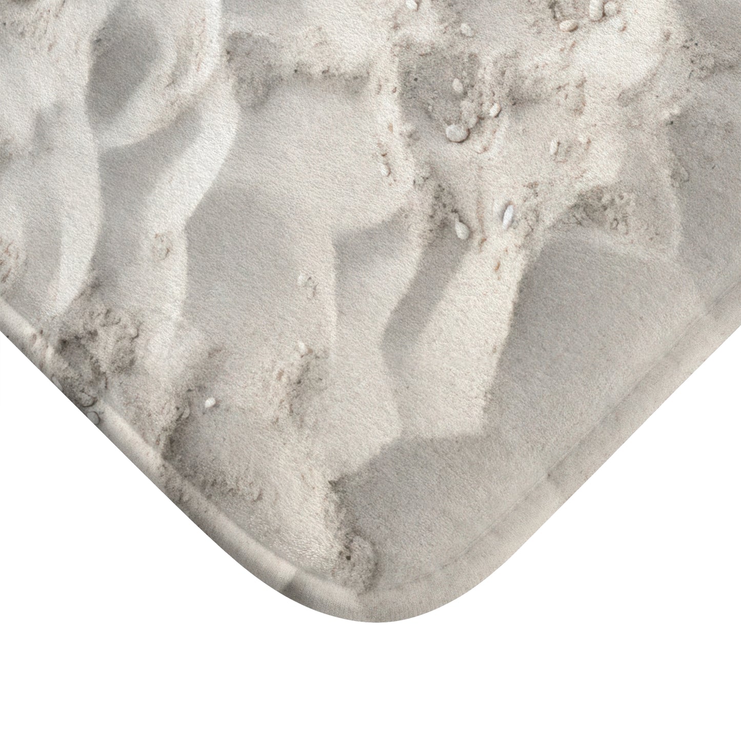 Transform your bathroom into a serene coastal retreat with Walking On Sand - Decor Bath Mat. The captivating white sand beach graphic, crafted from durable 100% microfiber, creates a tranquil haven. Its anti-slip backside ensures stability and the detailed binding guarantees long-lasting quality.